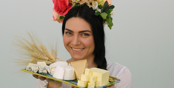 Woman Offering A Cheese Platter