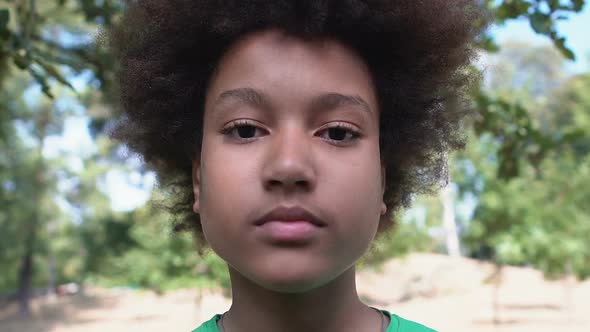 Amazed Afro-American Male Teenager Covering Mouth Hand, Fear Expression, Mistake