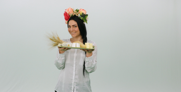 Woman With Back to Camera Turns With A Cheese Platter