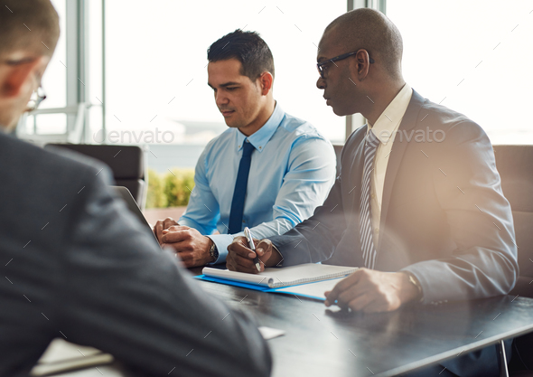 Business executives in a management meeting - Stock Photo - Images