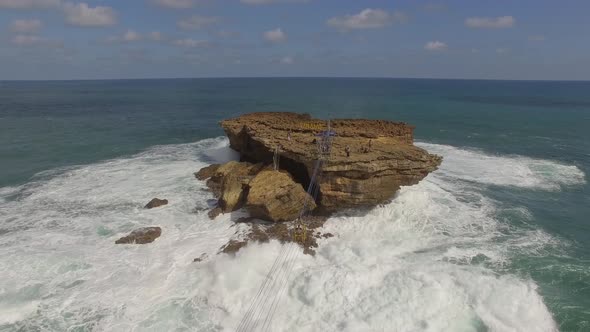 Aerial view cable car connecting isolate rock formation, Jogjakarta, Indonesia alt