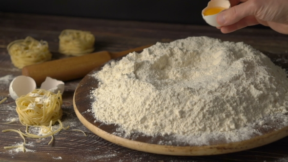 Egg Dropping Into Flour