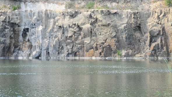 Precipitous Steep Rocky Shore With Abrupt Cliffs Near Water