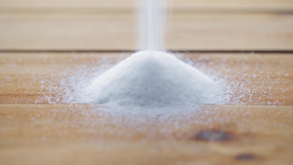White Sugar Pouring Into Heap On Wooden Table 77 alt