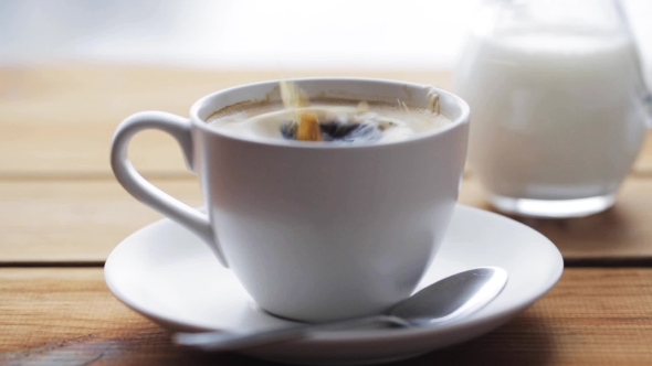 Sugar Falling Into Cup Of Coffee On Wooden Table 69, Stock Footage