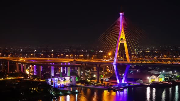time lapse of Bhumibol suspension bridge cross over Chao Phraya River at night in Bangkok alt