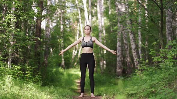 Close Up Asian Woman Practicing or Doing Yoga at the Park alt