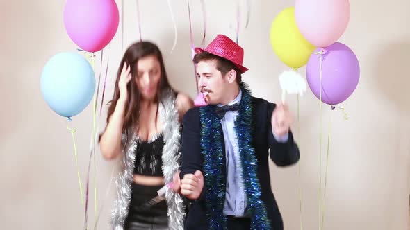 Crazy Couple Dancing And Blowing Party Horns Stock Footage Videohive