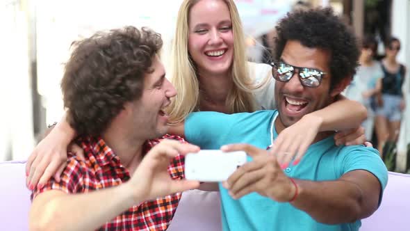 Three Young Adults Having Fun Taking Spontaneous Selfies 2 alt