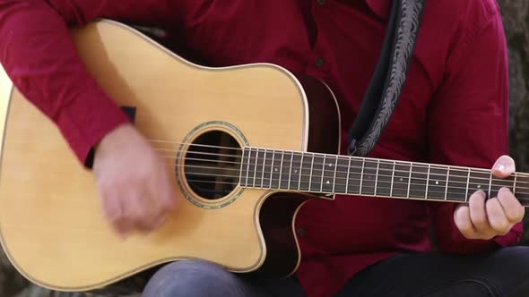 Man Playing The Guitar alt