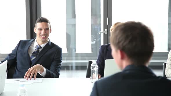 Business People Sitting At Table In Conference Room And Listening Presentation 1 alt
