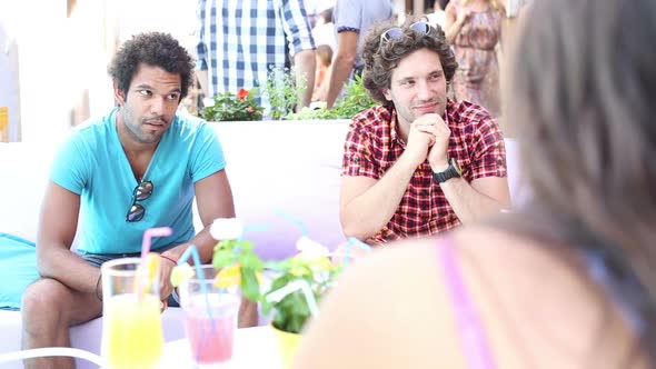Two Male Friends Sitting On Terrace Cafe In Summer 2 alt