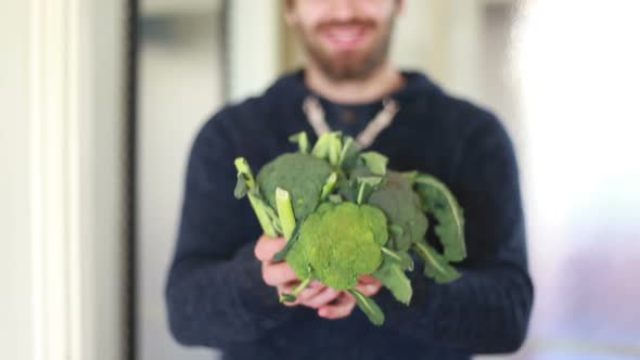 View Of Man Hands Holding Bunch Of Broccoli alt