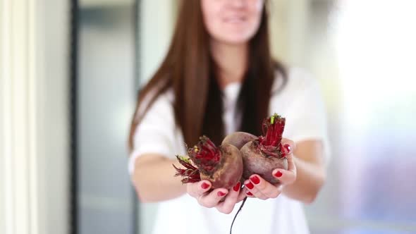 View Of Woman Hands Holding Beetroots alt