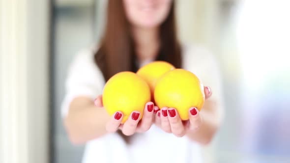 View Of Woman Hands Holding Lemons 2 alt