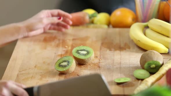 Woman Cutting Kiwi alt