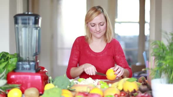 Woman Cutting Orange For Fruit Shake 1 alt