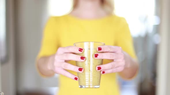 Woman Hands Holding Glass Of Smoothie alt
