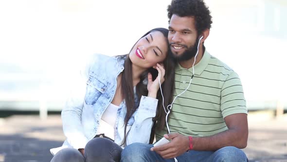 Woman Leaning Head On Man's Shoulder While They Listening To Music 1 alt