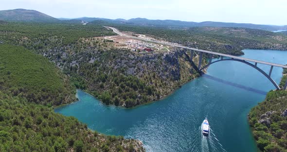 Aerial View Of Boat Sailing Towards Krka Bridge, Croatia 6 alt