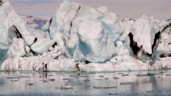 Camera Moves Along Big Icebergs At Jokulsarlon Iceland  