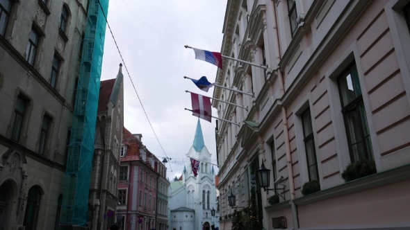 Latvian, UK, EU And Russian National Flags At Riga Old Town, Riga, Latvia alt