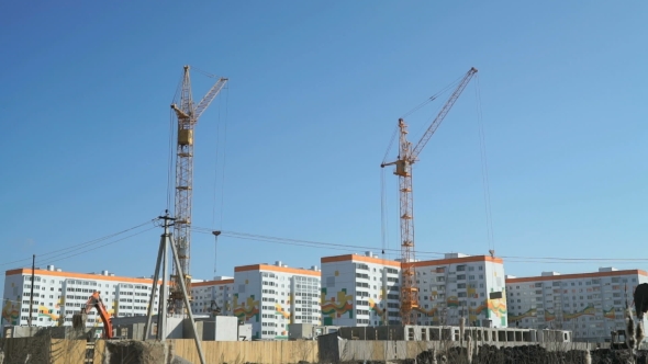 Construction Cranes Work At Construction Site