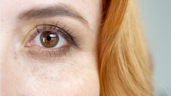 Brown Eye of a Woman With Foxy Hair