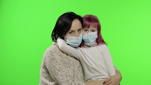 Sick Mother and Daughter in Medical Mask. Coronavirus Concept. Family Quarantine alt