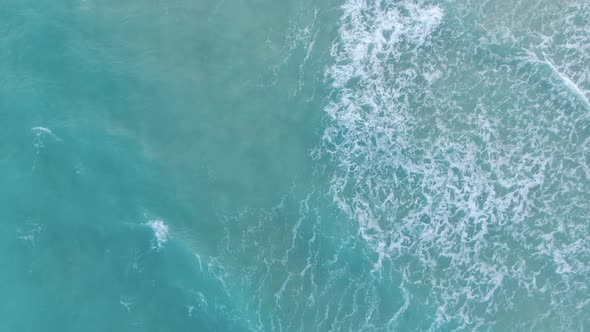 Turquoise Blue Waves In Slow Motion At Miami Beach In Florida With Mid-Beach Neighborhood Revealed. alt