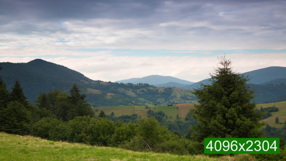 Multi-Layered Clouds over Forested Mountains alt