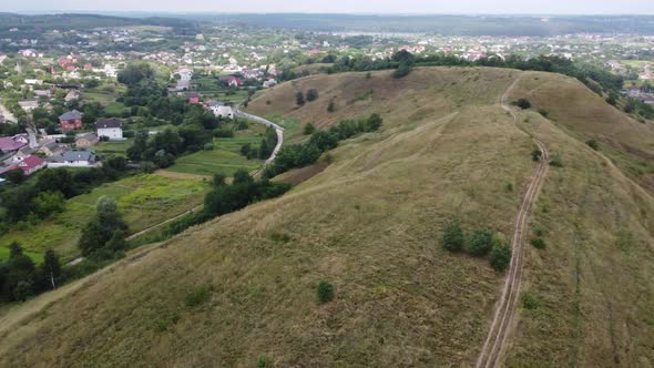 Extensive Rural Landscape with Patches of Fields Orchards and Hedges alt