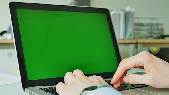 Businessman Typing on the Laptop with Green Screen 