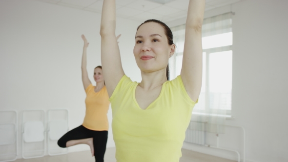 Yoga Class  Group Of Women Exercising Healthy Lifestyle In Fitness Studio alt