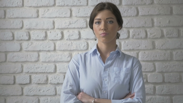 Portrait Of Pretty Serious Woman Looking At Camera alt