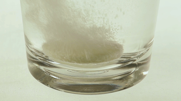 Soluble Pill in Glass of Water
