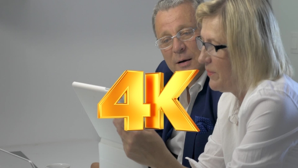 Businesspeople Working With Tablet alt