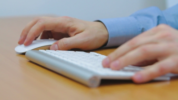 Man Typing On Computer Keyboard 