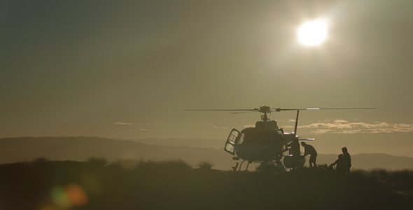 Helicopter Drop Off, Unloading and Lifting off By Sunset