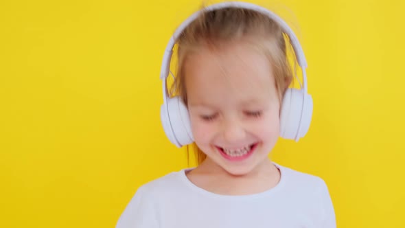 Happy Little Girl Listening Music Wireless Headphones Dancing Moving Rhythm