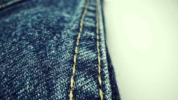 Extreme Detailed of Blue Denim Jeans Texture in Dolly Shot Over Cloth Surface alt