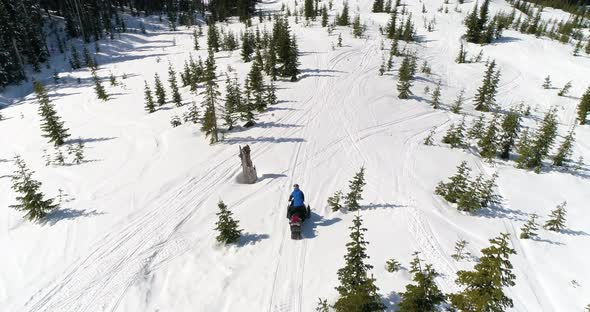 Snowmobile Winter Man Traveling Trail Through Mountain Pass alt