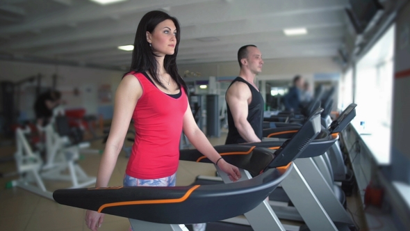 Beautiful Girl Walking On a Treadmill alt