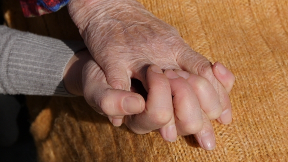 A Young Female Hands Comforting An Elderly Pair Of Hands Of Grandma Outdoor . alt