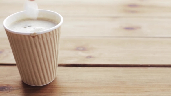 Hand Adding And Stirring Sugar In Cup Of Coffee 72 alt