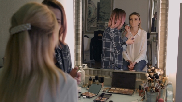 Attractive Business Woman In a Beauty Salon. Professional Stylist Making Make-up Day alt