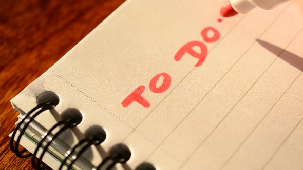 Writing To Do List With a Red Felt Pen Or Marker In a Notepad