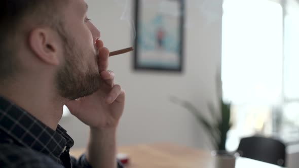 Person Smoking Cigar Indoor