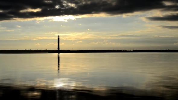 Water Landscape With Lighthouse, Dramatic Clouds