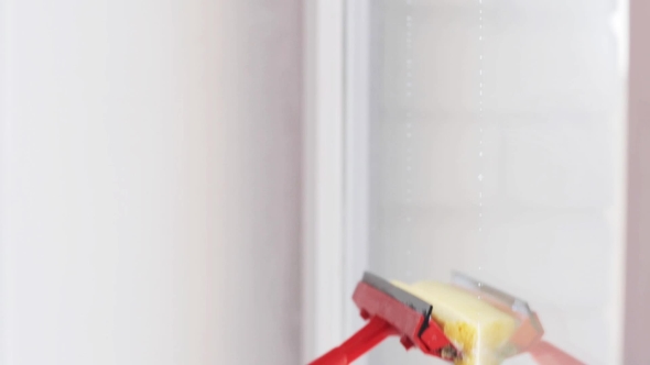 Hands With Sponge Mop Cleaning Window At Home 21 alt